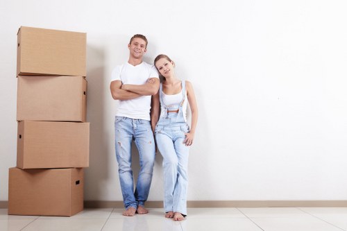 Moving team preparing a Borough home removal with boxes and furniture