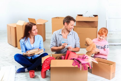 Unpacking household boxes in a Borough property to help settle in faster