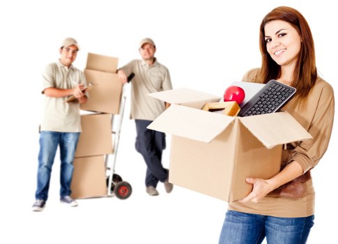 Furniture being carried through a narrow stairwell in a Borough flat move