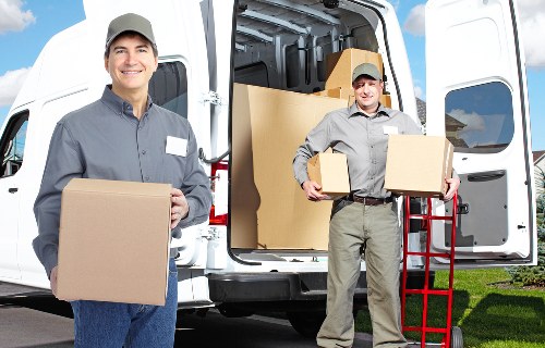 Trained movers handling furniture carefully in a Borough property