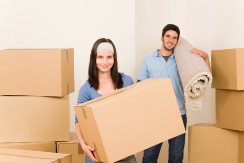 Local moving team loading furniture into a van in Borough
