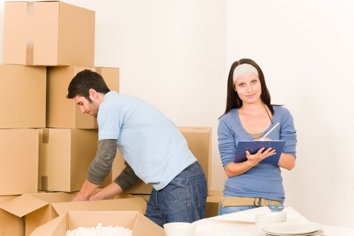 Flat removals team coordinating delivery to a modern apartment building in Borough