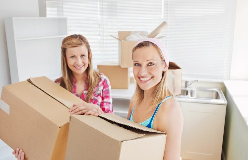 Packed moving boxes and furniture ready for a Borough home relocation