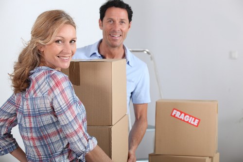 Careful packing of fragile home belongings with labels and protective wrap