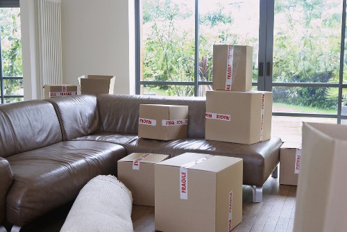 Loading household boxes and furniture into a removal truck in Borough